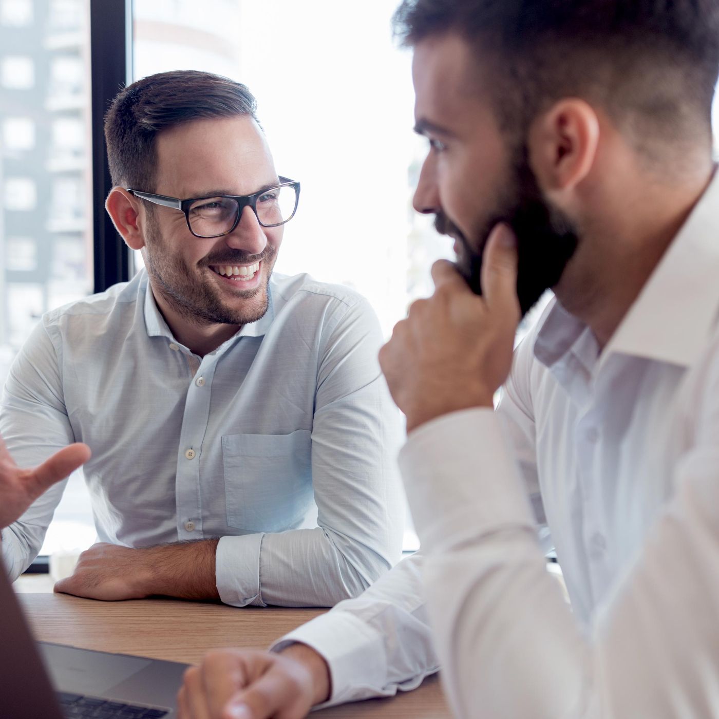 Business owner smiling whilst being told about their different PPA options